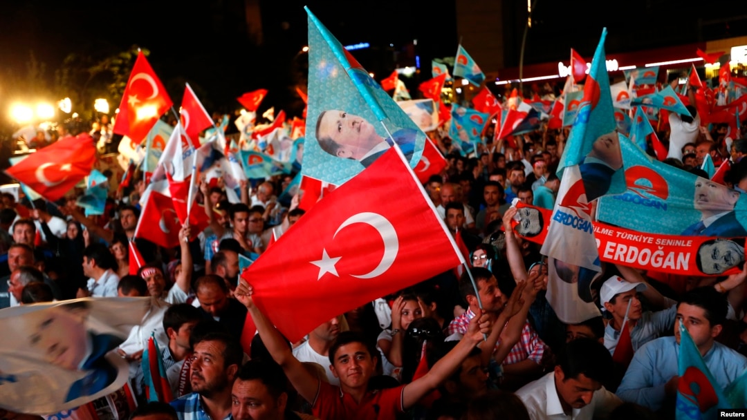 Supporters of Turkey's Prime Minister Recep Tayyip Erdogan celebrate his election victory in front of his party's headquarters in Ankara August 10, 2014.