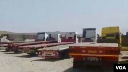 In this screen grab of a video verified by VOA Persian, trucks sit idle in the western Iranian city of Kangavar, May 29, 2018, as drivers participate in a nationwide truckers’ strike that began May 22.