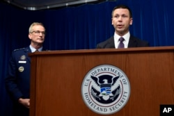 U.S. Customs and Border Protection Commissioner Kevin McAleenan, right, speaks as Commander of United States Northern Command and North American Aerospace Defense Command General Terrence John O'Shaughnessy, left, listens during a news conference in Washington, Oct. 29, 2018.