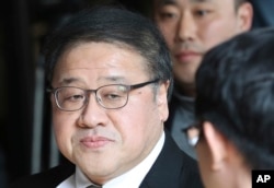 FILE - A former presidential secretary Ahn Jong-beom arrives for questioning at the Seoul Central District Prosecutors' Office in Seoul, South Korea, Nov. 2, 2016. South Korean prosecutors also requested an arrest warrant for a longtime another friend of President Park Geun-hye.