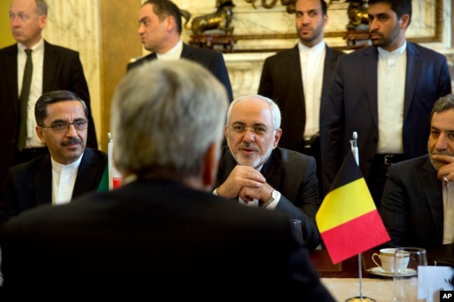 Iranian Foreign Minister Mohammad Javad Zarif, center right, speaks with Belgian Foreign Minister Didier Reynders during a meeting at the Egmont Palace in Brussels, Jan. 11, 2018. European Union foreign ministers held separate talks with their Iranian counterpart in Brussels amid doubts over the future of an international agreement curbing the Islamic Republic's nuclear ambitions.