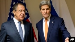 U.S. Secretary of State John Kerry, right, gestures as he meets with Russian Foreign Minister Sergey Lavrov about Syria, in Zurich, Switzerland, Jan. 20, 2016.