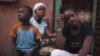 Refugees from the Malian town of Gao, which is now under the control of Islamist forces, pose at a private accommodation in the capital Bamako, September 8, 2012. 