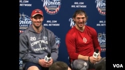 Capitals forwards Troy Brouwer and Alex Ovechkin who both scored in the Washington’s New Year’s Day Winter Classic victory over Chicago. (VOA News/Arash Arabasadi)