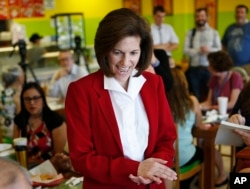 FILE - Nevada Democratic Senate candidate Catherine Cortez Masto meets with people at a campaign event at a restaurant in Las Vegas, May 31, 2016.
