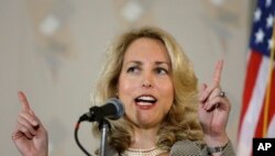 FILE - Former CIA officer Valerie Plame Wilson speaks at an event in Chicago, May 9, 2008.
