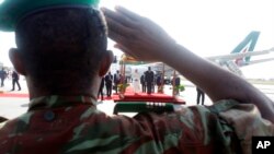 FILE - A soldier salutes in Africa's western coast country of Benin, Nov. 18, 2011. Two soldiers were killed Dec. 1, 2021, when Islamic militants attacked a border security post, the army said.