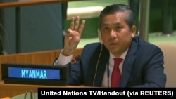 Myanmar's ambassador to the United Nations Kyaw Moe Tun holds up three fingers at the end of his speech to the General Assembly where he pleaded for International action in overturning the military coup in his country 