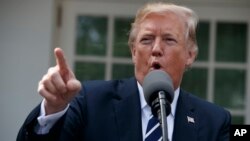 President Donald Trump speaks with reporters in the Rose Garden of the White House, in Washington, Oct. 16, 2017.