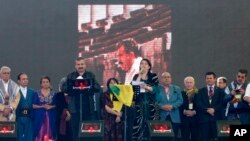 Pro-Kurdish politicians Sirri Sureyya Onder (3rd L) and Pervin Buldan (6th R) read the statement of jailed Kurdish rebel leader Abdullah Ocalan in the southeastern Turkish city of Diyarbakir March 21, 2013.