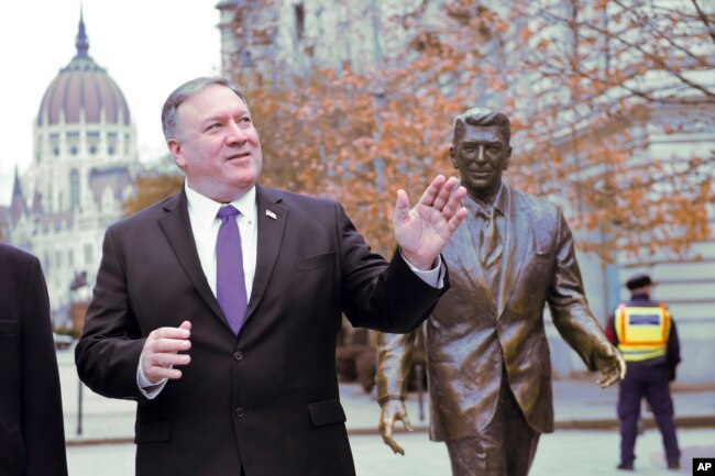U.S. Secretary of State Mike Pompeo is pictured next to a statue of former U.S. President Ronald Reagan at the Liberty square (Szabadsag) in Budapest, Hungary, Feb. 11, 2019.