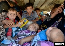 Refugees arrive at Sulaimaniya province, Iraq, Aug. 8, 2014.