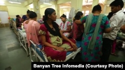 Beds and women crowd the maternity ward at the Scion public hospital in Mumbai, India.