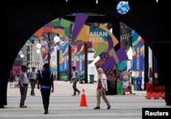 Secutiry personnel stand guard ahead of the 18th Asian Games at Gelora Bung Karno sports complex in Jakarta, Indonesia, Aug. 17, 2018.