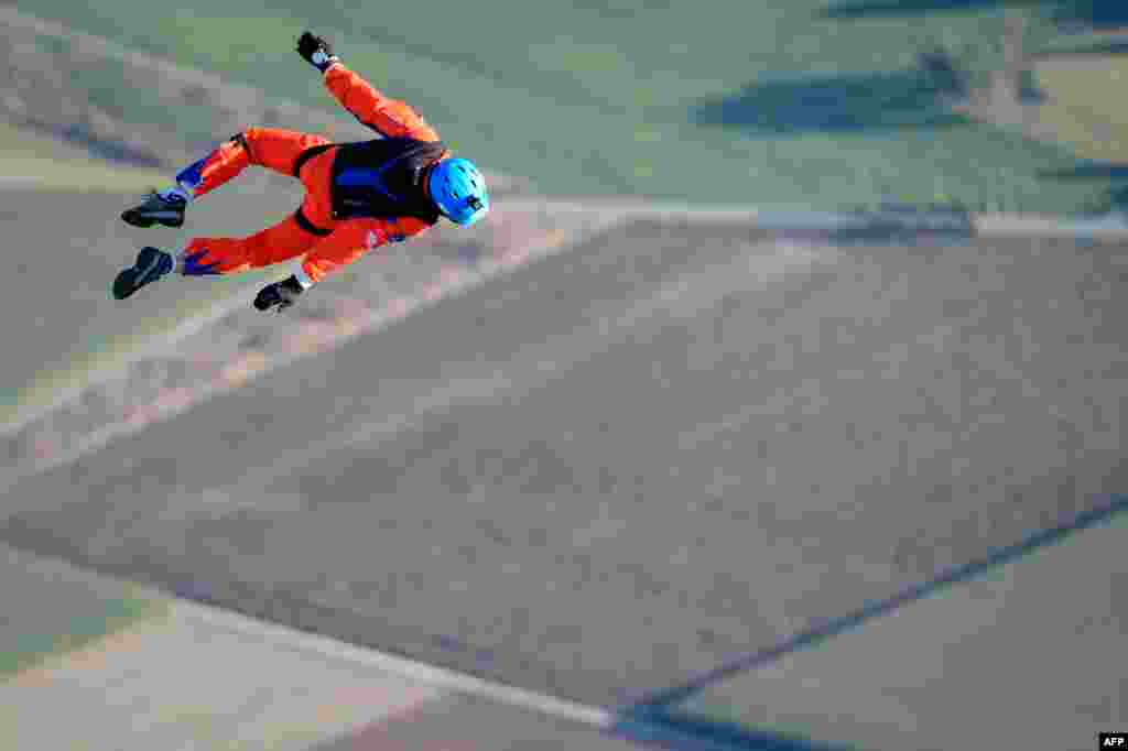 Initiator of sun-powered stratospheric SolarStratos plane project Raphael Domjan dives during a successful world record attempt by jumping with a parachute from a solar-powered plane, in Payerne, western Switzerland.