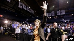 FILE- Tennessee head coach Pat Summitt waves as she leaves the court after Tennessee defeated DePaul, 63-48, in an NCAA tournament second-round women's college basketball game in Rosemont, Illinois, March 19, 2012.