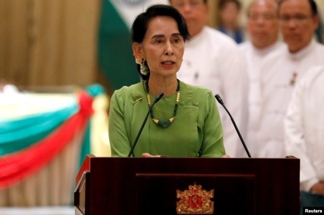 FILE - Aung San Suu Kyi talks during a news conference in Naypyitaw, Myanmar, Sept. 6, 2017.