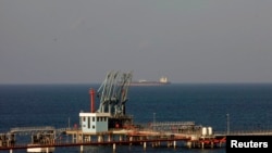 FILE - A view of pipelines and a loading berth of the Marsa al Hariga oil port in the city of Tobruk, east of Tripoli, Libya.