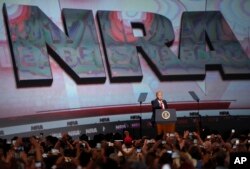 FILE - U.S. President Donald Trump speaks during the National Rifle Association-ILA Leadership Forum, April 28, 2017, in Atlanta.