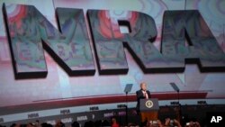 U.S. President Donald Trump speaks during the National Rifle Association-ILA Leadership Forum, April 28, 2017, in Atlanta. 