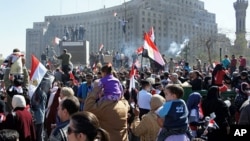 Crowds turn out to celebrate in Cairo's Tahrir Square, marking the success of a popular uprising and honoring the protesters who were killed, February 18, 2011
