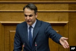 New Democracy party leader Kyriakos Mitsotakis addresses lawmakers during a parliamentary session in Athens, on June 16, 2018.