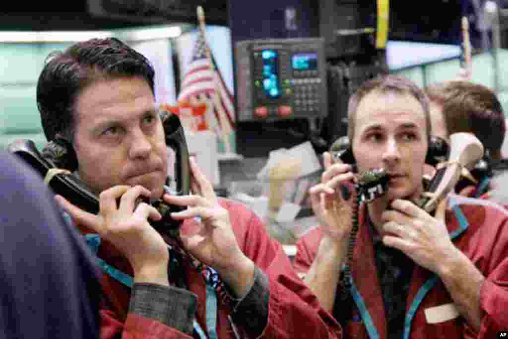 Traders work in the oil options pit at the New York Mercantile Exchange Wednesday, March 9, 2011. Crude oil prices were slightly above $105 a barrel in early trading. The conflict in Libya has raised concerns about a drop in oil production, causing a surg
