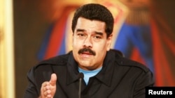 Venezuela's President Nicolas Maduro speaks during a meeting with mayors and governors at Miraflores Palace in Caracas, May 19, 2014.