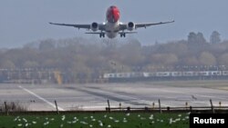 An aeroplane lands at Gatwick Airport, after the airport reopened to flights following its forced closure because of drone activity, in Gatwick, Britain, December 21, 2018.