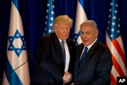 U.S. President Donald Trump and Israeli Prime Minister Benjamin Netanyahu shake hands in Jerusalem, May 22, 2017.