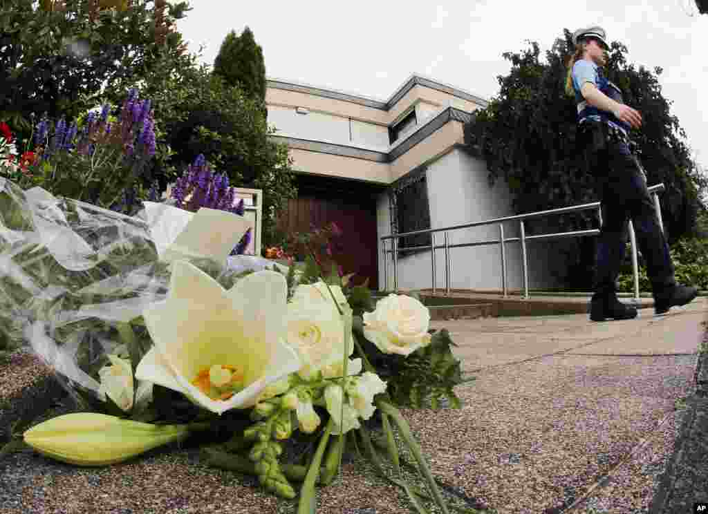 Flowers sit in front of the house of former German Chancellor Helmut Kohl in Oggersheim, Germany. Kohl, 87, died Friday.