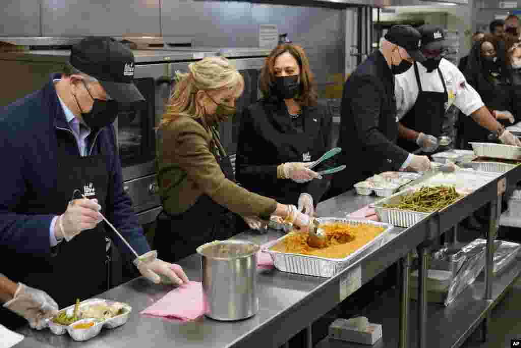 President Joe Biden, first lady Jill Biden, Vice President Kamala Harris, and second gentleman Doug Emhoff, put together Thanksgiving meal kits during a visit to DC Central Kitchen in Washington, Nov. 23, 2021.