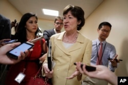 Sen. Susan Collins, R-Maine, a member of the Senate Select Committee on Intelligence, talks to reporters in a corridor at the Capitol in Washington, June 21, 2017.