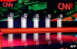 Photographs of Democratic presidential candidates hang on their debate podiums a day before the CNN Facebook Democratic Debate at the Wynn Las Vegas in Nevada, Oct. 12, 2015.