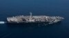 The Nimitz-class aircraft carrier USS Abraham Lincoln transits the Strait of Gibraltar, entering the Mediterranean Sea as it continues operations in the 6th Fleet area of responsibility, April 13, 2019.