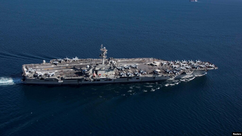 FILE - The Nimitz-class aircraft carrier USS Abraham Lincoln transits the Strait of Gibraltar, entering the Mediterranean Sea, April 13, 2019.