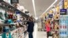 FILE - Consumers shop at a Walmart store in Vernon Hills, Ill., May 23, 2021. 