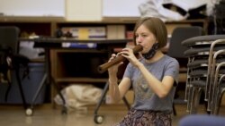 Kaitlin Nordstrom plays a Thai flute for Thai ensemble at Kent State University, OH.