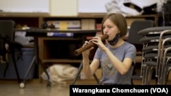 Kaitlin Nordstrom plays a Thai flute for Thai ensemble at Kent State University, OH.