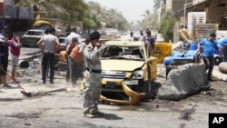 23일 이라크 바그다드 인근의 폭탄 테러 현장.