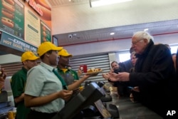 Democratic presidential candidate, Sen. Bernie Sanders, I-Vt., orders hot dogs at Nathans Famous in Coney Island in the Brooklyn borough of New York, Sunday, April 10, 2016.