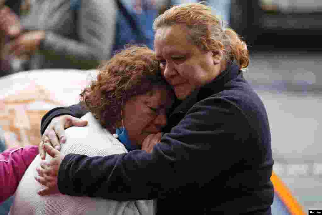 Relatives wait for news of their loved ones after an earthquake in Mexico City, Mexico.