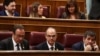 FILE - Jailed Catalan politicians Jordi Sanchez, Josep Rull and Jordi Turull attend the first session of parliament following a general election in Madrid, Spain, May 21, 2019.