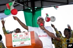 FILE - President Pierre Nkurunziza gestures as he launches the ruling party's campaign calling for a "Yes" vote in the upcoming constitutional referendum, in Bugendana, Gitega province, Burundi, May 2, 2018.