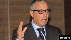 Libyan Prime Minister Ali Zeidan tried to rally support after militiamen surrounded the Foreign Ministry in Tripoli.