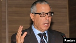 Libyan Prime Minister Ali Zeidan tried to rally support after militiamen surrounded the Foreign Ministry in Tripoli.