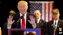 Republican presidential candidate Donald Trump answers questions about donations to veteran groups during a news conference in New York, May 31, 2016. 