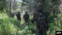 African Union-led Ugandan soldiers search for LRA rebels in the Central African Republic on June 24, 2014. (AFP PHOTO/MICHEL SIBILONI)