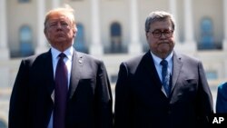 President Donald Trump stands with Attorney General William Barr during the 38th Annual National Peace Officers' Memorial Service at the U.S. Capitol, May 15, 2019.