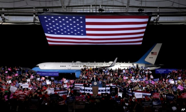 President Donald Trump addresses the crowd during a campaign rally, Nov. 1, 2018, in Columbia, Mo.